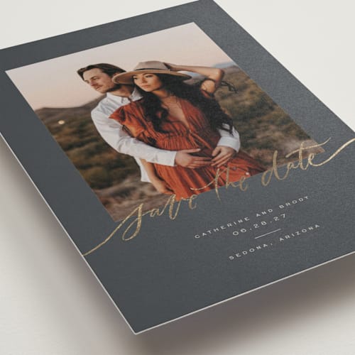 This is a night sky foil stamped save the date cards with foil pressed by Wildfield Paper Co called midnight printing on recycled smooth signature in standard