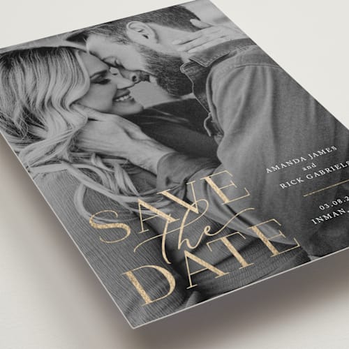 This is a snow foil stamped save the date cards with foil pressed by Deynaaz Daraei called viola printing on recycled smooth signature in standard