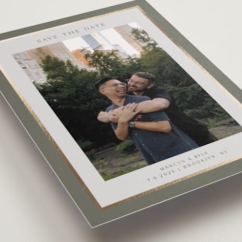 This is a sage foil stamped save the date cards with foil pressed by Nicole Walsh called foil frame printing on recycled smooth signature in standard