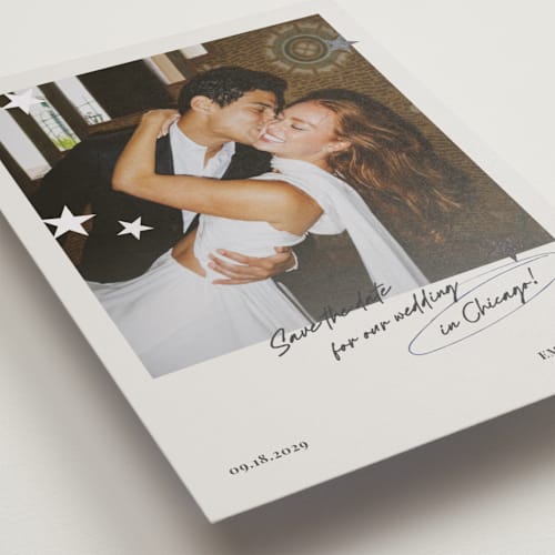 This is a azure foil stamped save the date cards with foil pressed by Helena Vitto called stars printing on recycled smooth signature in standard