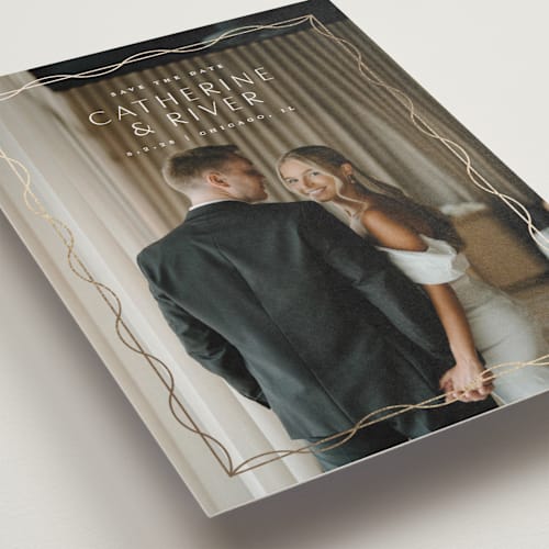 This is a silk foil stamped save the date cards with foil pressed by Lauren Chism called delicate frame printing on recycled smooth signature in standard