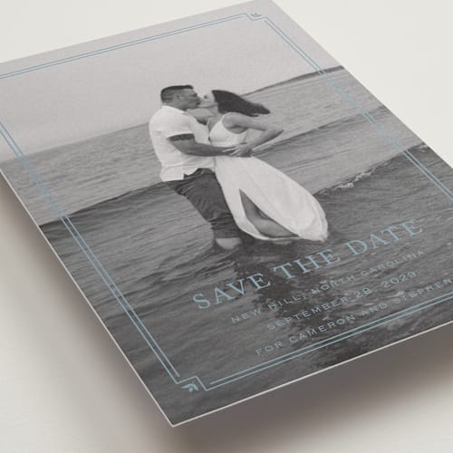 This is a french blue save the date with standard by Carolyn MacLaren called fleur corner printing on recycled smooth signature in standard