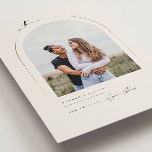 This is a champagne save the date with standard by Benita Crandall called l'arch printing on recycled smooth signature in standard