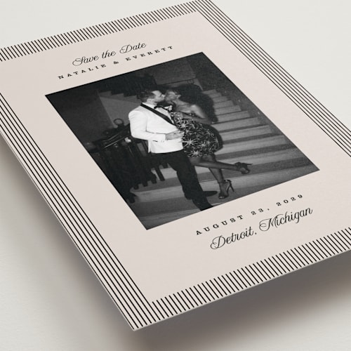 This is a noir save the date with standard by Pixel and Hank called linea printing on recycled smooth signature in standard