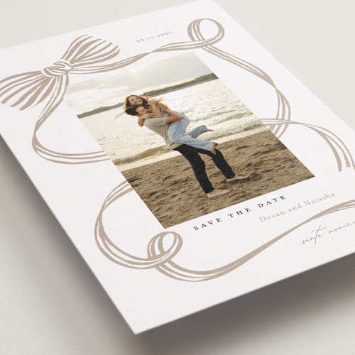 This is a tan save the date with standard by Carrie ONeal called neddy printing on recycled smooth signature in standard