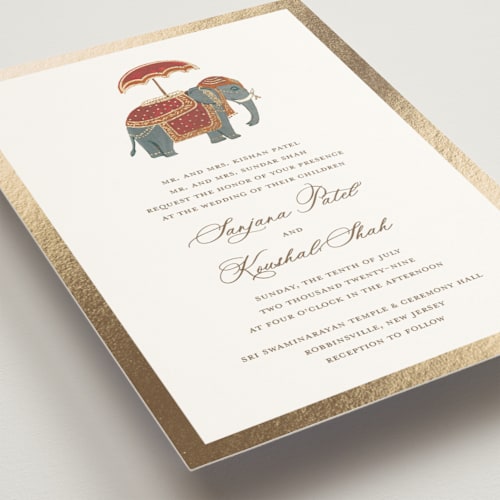This is a milk foil stamped wedding invitations with foil pressed by Teju Reval called indian elephant printing on signature in standard