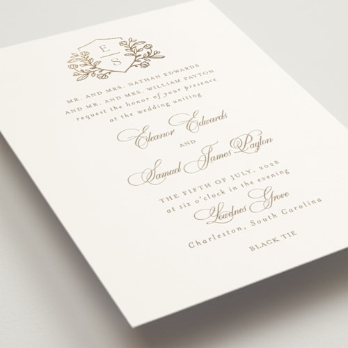 This is a ivory foil stamped wedding invitations with foil pressed by Mansi Verma called gold crest printing on signature in standard
