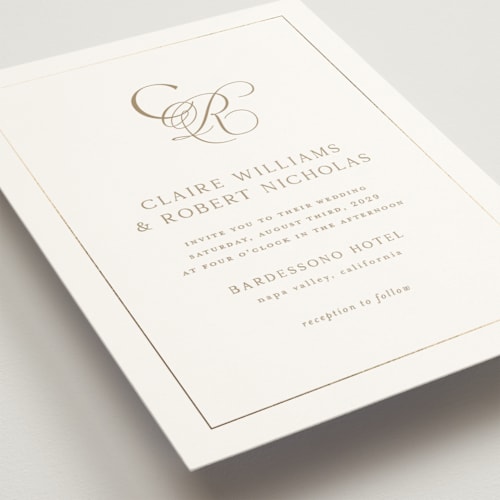 This is a golden foil stamped wedding invitations with foil pressed by Kelly Schmidt called monogram script printing on signature in standard
