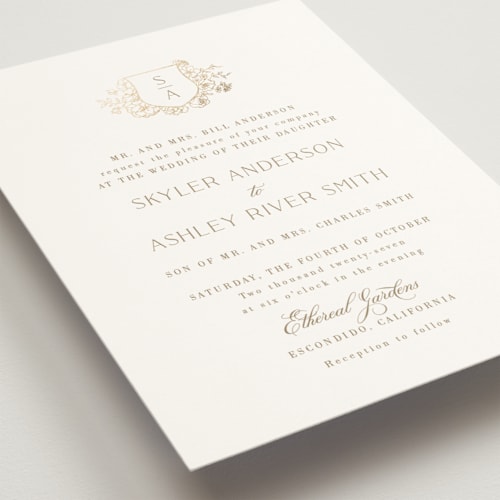 This is a champagne foil stamped wedding invitations with foil pressed by Cass Loh called floral crest printing on signature in standard
