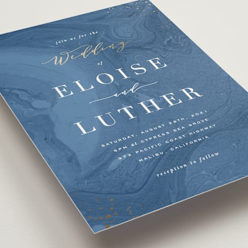 This is a royal blue foil stamped wedding invitations with foil pressed by Hooray Creative called moody marbling printing on signature in standard