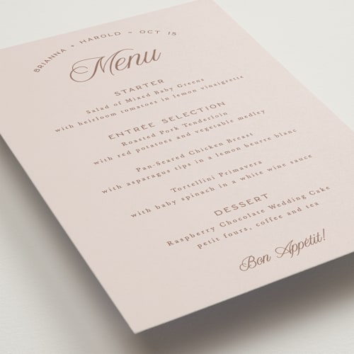 This is a dusty rose menu cards with standard by Hooray Creative called arching type printing on signature in standard