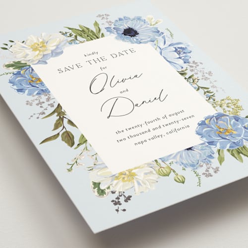 This is a azure foil stamped save the date cards with foil pressed by Susan Moyal called timeless blooms printing on signature in standard
