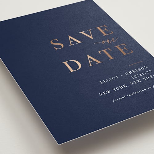 This is a navy foil stamped save the date cards with foil pressed by Sarah Wilde called greyson printing on signature in standard