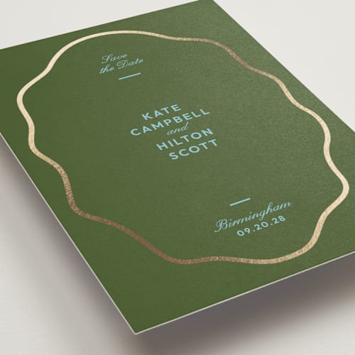 This is a olive foil stamped save the date cards with foil pressed by Megan Davis called croquet printing on signature in standard