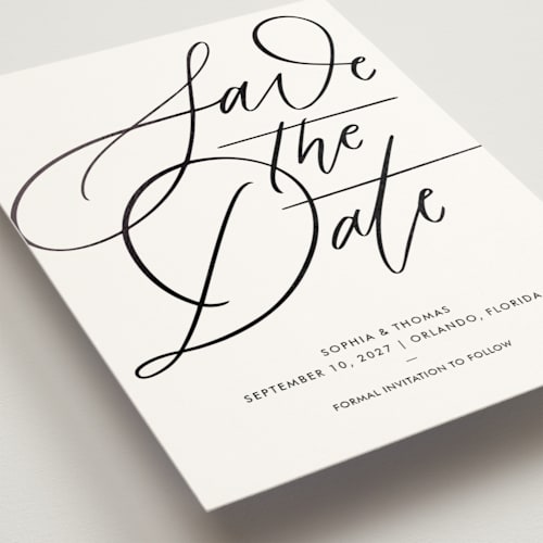 This is a snow foil stamped save the date cards with foil pressed by Kristen Smith called delicate dates printing on signature in standard