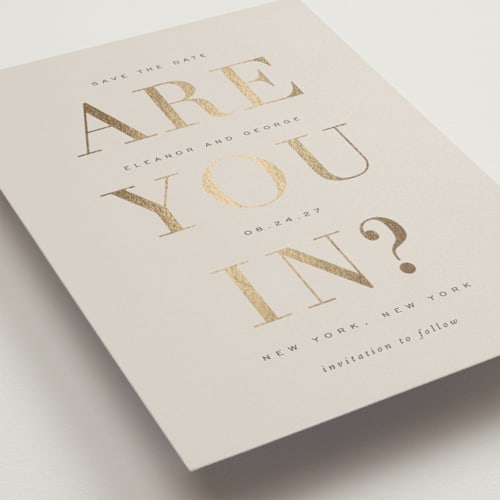 This is a taupe foil stamped save the date cards with foil pressed by Sara Hicks Malone called are you in? printing on signature in standard