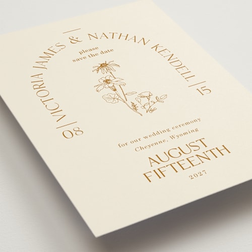 This is a cream save the date with standard by Baumbirdy called floral type arch printing on signature in standard