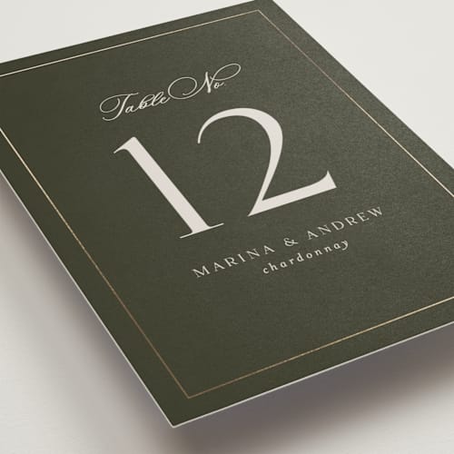 This is a deep olive table numbers with foil pressed by Nicole Walsh called refined printing on doublethick in standard