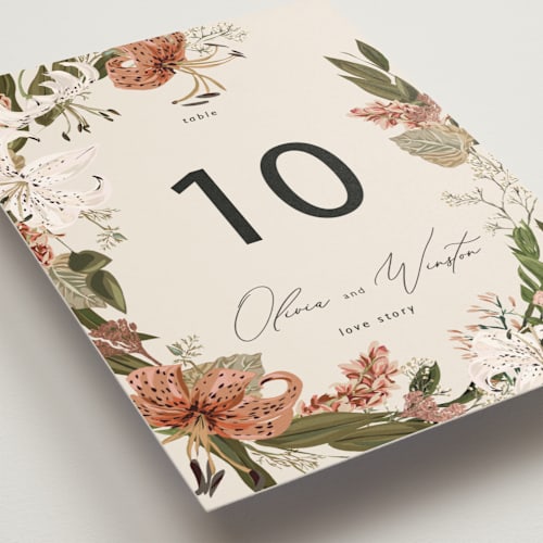 This is a terracotta table numbers with foil pressed by Susan Moyal called delicate printing on doublethick in standard