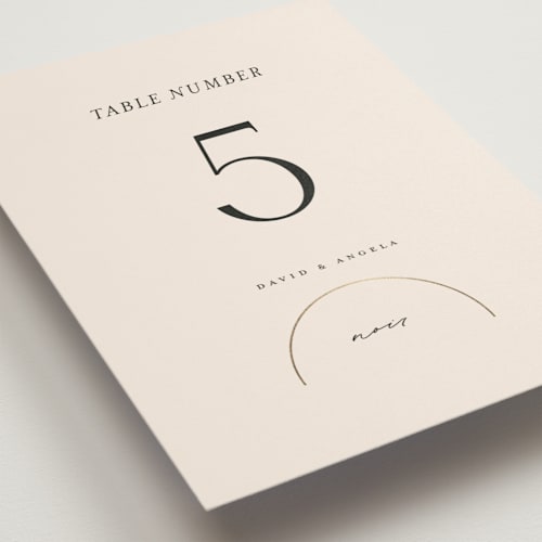 This is a latte table numbers with foil pressed by Christie Garcia called modernist monogram printing on doublethick in standard