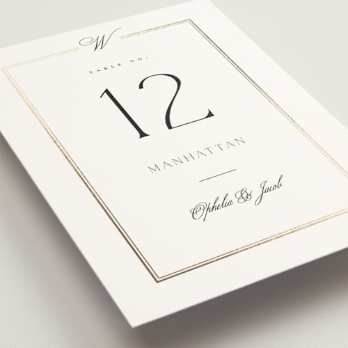 This is a pearl table numbers with foil pressed by Leah Bisch called elegant type printing on doublethick in standard