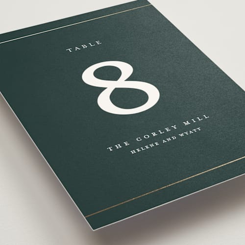 This is a forest table numbers with foil pressed by Stacey Meacham called style and grace printing on doublethick in standard