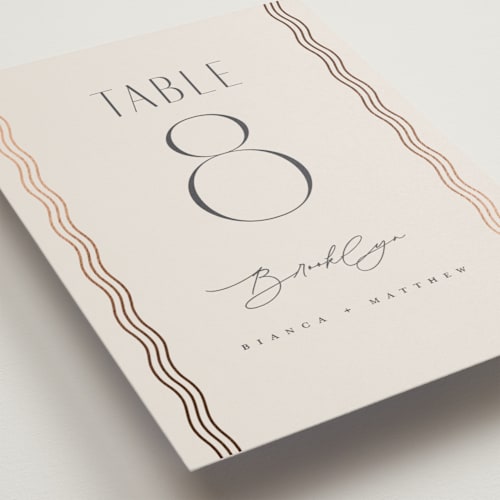 This is a bisque table numbers with foil pressed by Kristie Kern called newberry printing on doublethick in standard