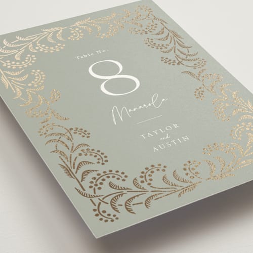 This is a willow table numbers with foil pressed by Leia Matt called riviera printing on doublethick in standard