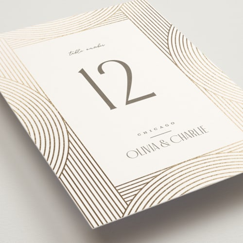 This is a alabaster table numbers with foil pressed by Pixel and Hank called moderne printing on doublethick in standard