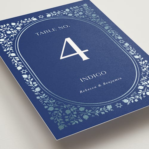 This is a royal table numbers with foil pressed by Nam Bourassa called pomegranate floral frame printing on doublethick in standard
