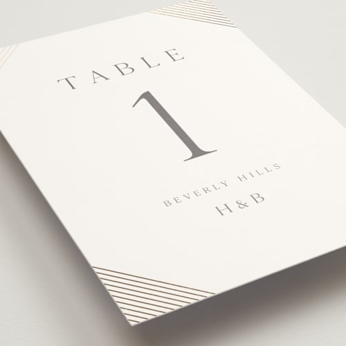 This is a slate table numbers with foil pressed by Vanessa Doyle called song of solomon printing on doublethick in standard