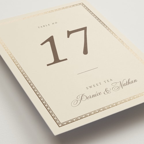 This is a champagne table numbers with foil pressed by Deynaaz Daraei called ahlum printing on doublethick in standard