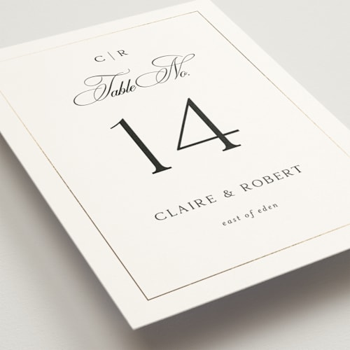 This is a silk table numbers with foil pressed by Kelly Schmidt called monogram script printing on doublethick in standard