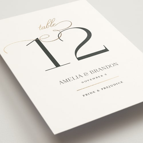This is a sugar table numbers with foil pressed by Jessica Williams called elegant flourish printing on doublethick in standard