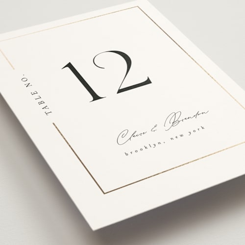 This is a silk table numbers with foil pressed by Kelly Schmidt called gilded border printing on doublethick in standard