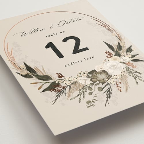 This is a latte table numbers with foil pressed by Susan Moyal called botanical edge printing on doublethick in standard