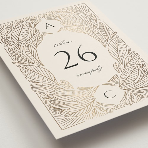 This is a cream table numbers with foil pressed by Jen Owens called royalty printing on doublethick in standard