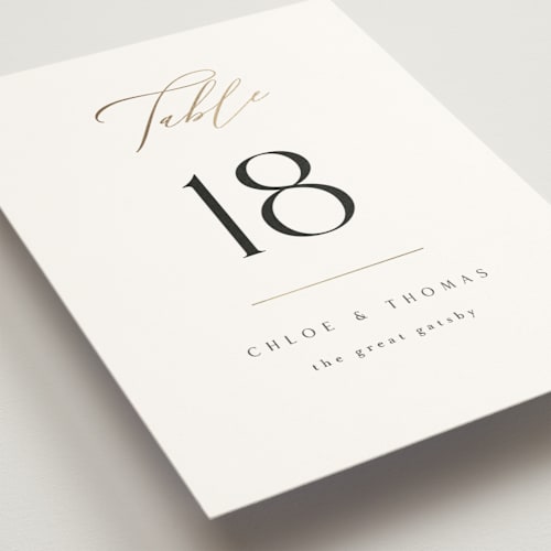 This is a silk table numbers with foil pressed by Kelly Schmidt called overlay printing on doublethick in standard