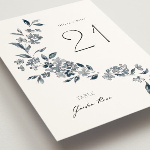 This is a prussian blue table numbers with foil pressed by Itsy Belle Studio called sweeping vine printing on doublethick in standard
