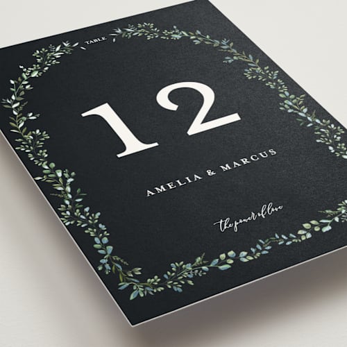 This is a emerald table numbers with foil pressed by Susan Moyal called monogramed arch printing on doublethick in standard