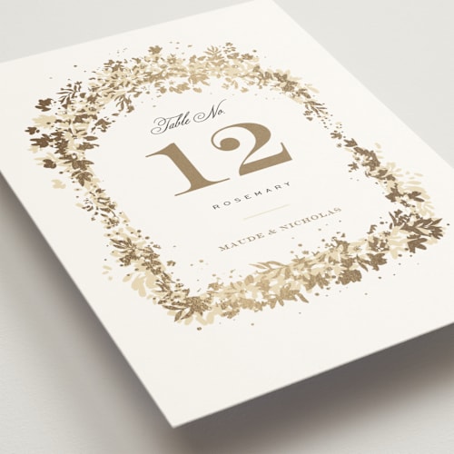 This is a honeysuckle table numbers with foil pressed by Leah Bisch called heritage printing on doublethick in standard