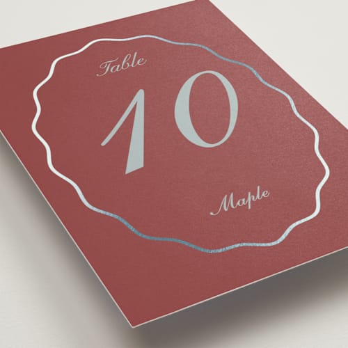 This is a burgundy table numbers with foil pressed by Baumbirdy called scallop frame printing on doublethick in standard