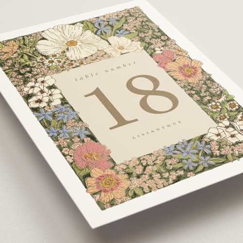 This is a sherbert table numbers with foil pressed by Leah Bisch called in the garden printing on doublethick in standard