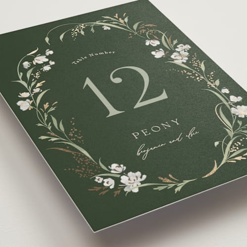 This is a forest floor table numbers with foil pressed by Erin L. Wilson called meadow printing on doublethick in standard