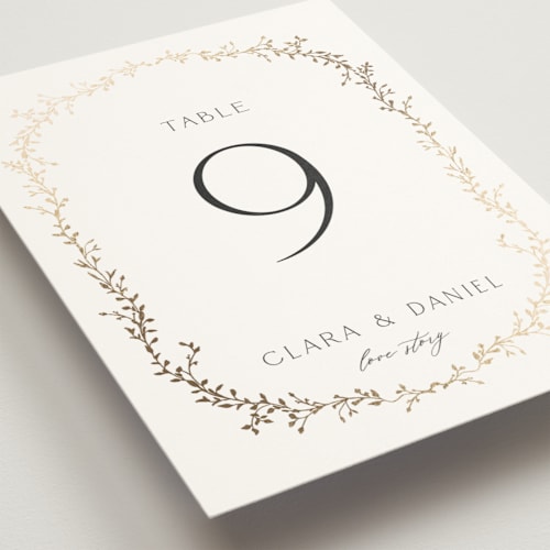 This is a alabaster table numbers with foil pressed by Susan Moyal called delicate vine printing on doublethick in standard