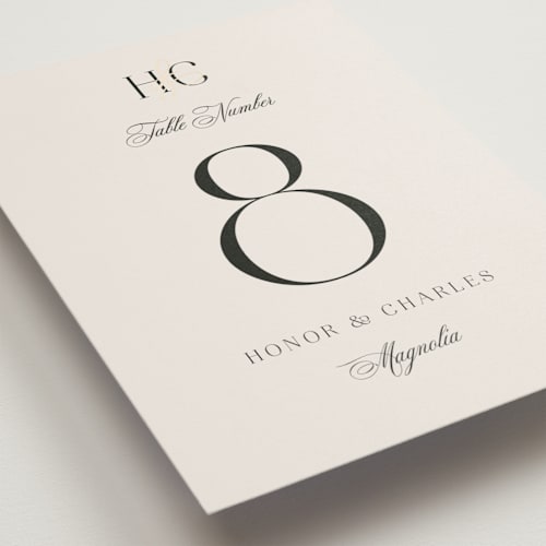 This is a ivory table numbers with foil pressed by Melanie Kosuge called honor printing on doublethick in standard