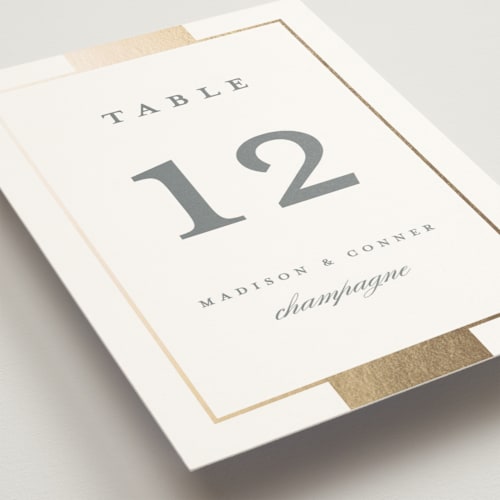 This is a slate table numbers with foil pressed by Stacey Meacham called refined style printing on doublethick in standard