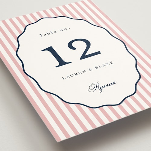 This is a navy peony table numbers with standard by Emily Betts called curved frame printing on doublethick in standard