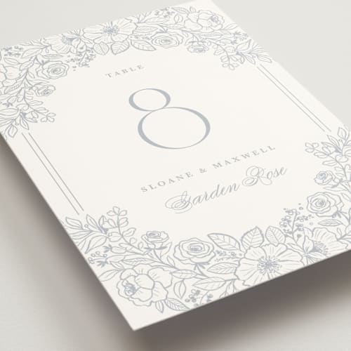 This is a powder blue table numbers with standard by Kristen Smith called wild roses printing on doublethick in standard