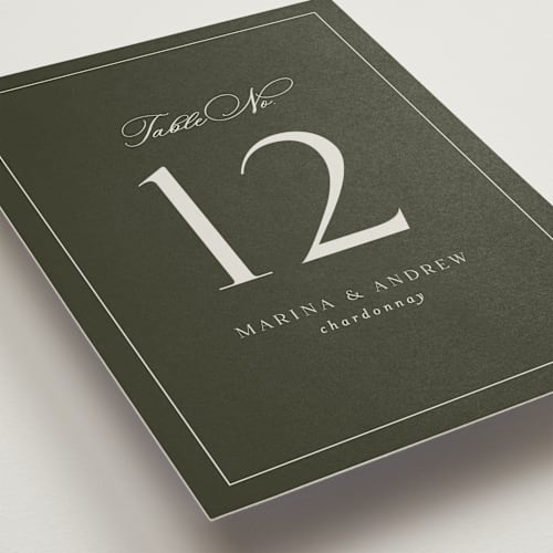 This is a deep olive table numbers with standard by Nicole Walsh called refined printing on doublethick in standard